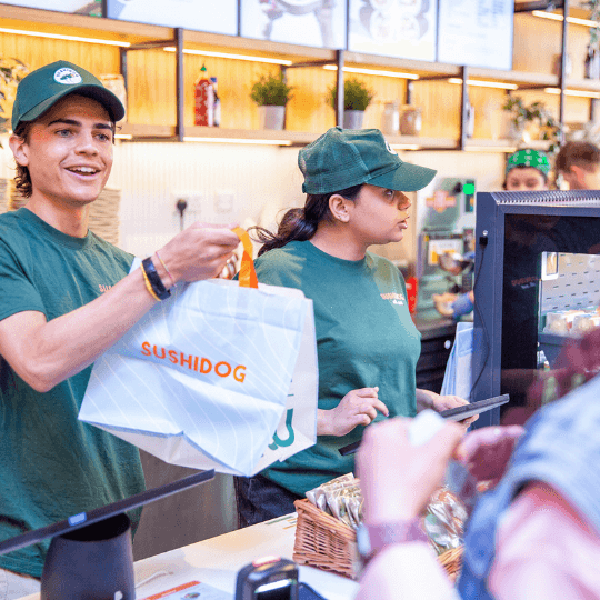man handing food